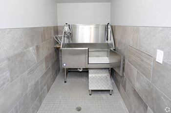 A large stainless steel sink in a commercial kitchen